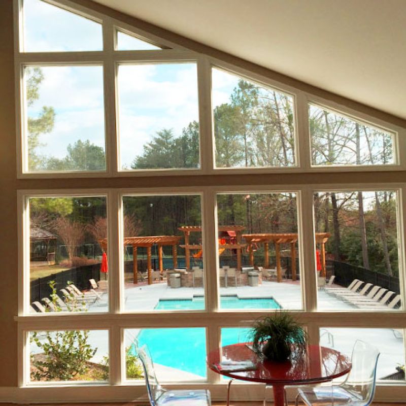 New large window overlooking pool area.