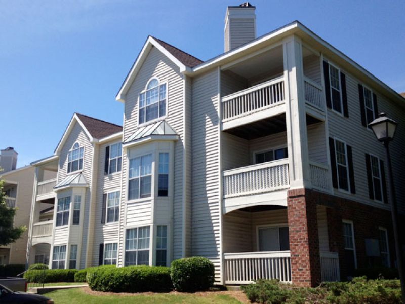 Apartment roofing being maintained.