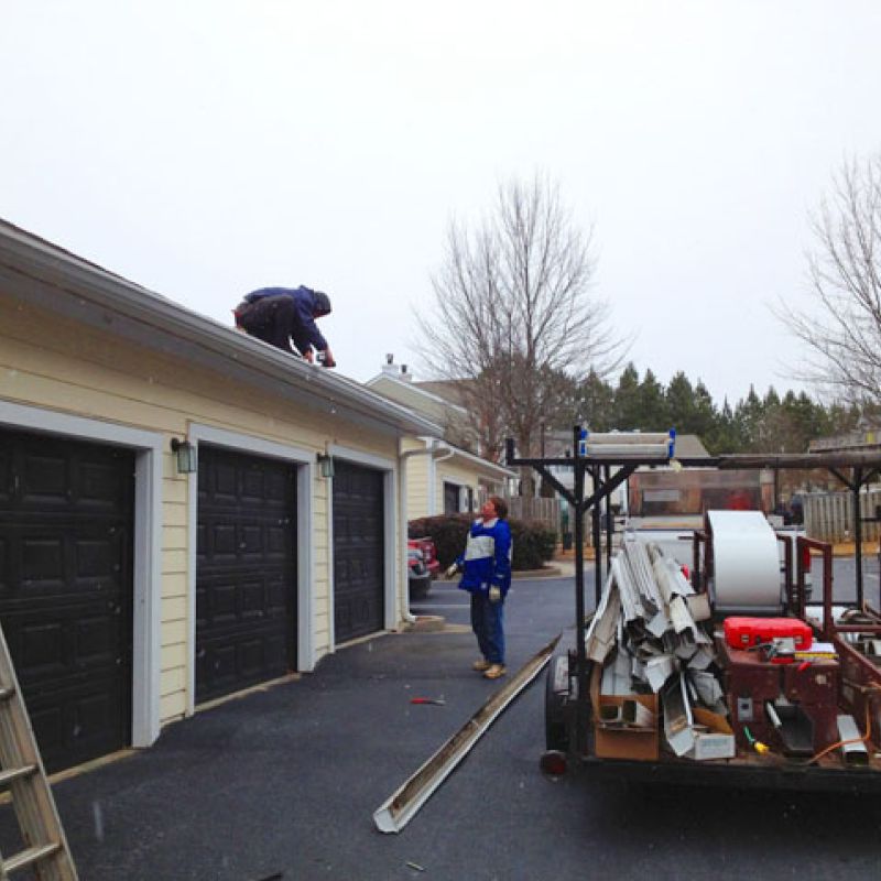 Commercial gutters being installed.