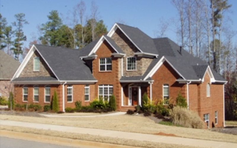 Residential home with new gutters and windows installed.